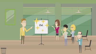 Cartoonzeichnung: Dozent steht jubelnd an der Tafel, an der "Ziel" geschrieben steht, die Kursteilnehmenden im Vordergrund klatschen