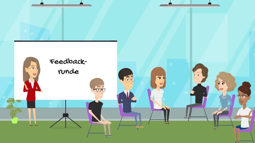 Das Bild zeigt, wie Amalia Schulte in ihrem Seminar eine Feedbackrunde mit den Teilnehmenden durchführt.